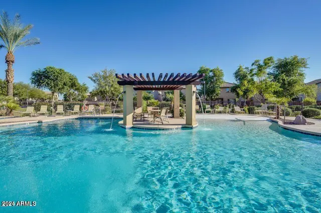 a view of a swimming pool with a patio