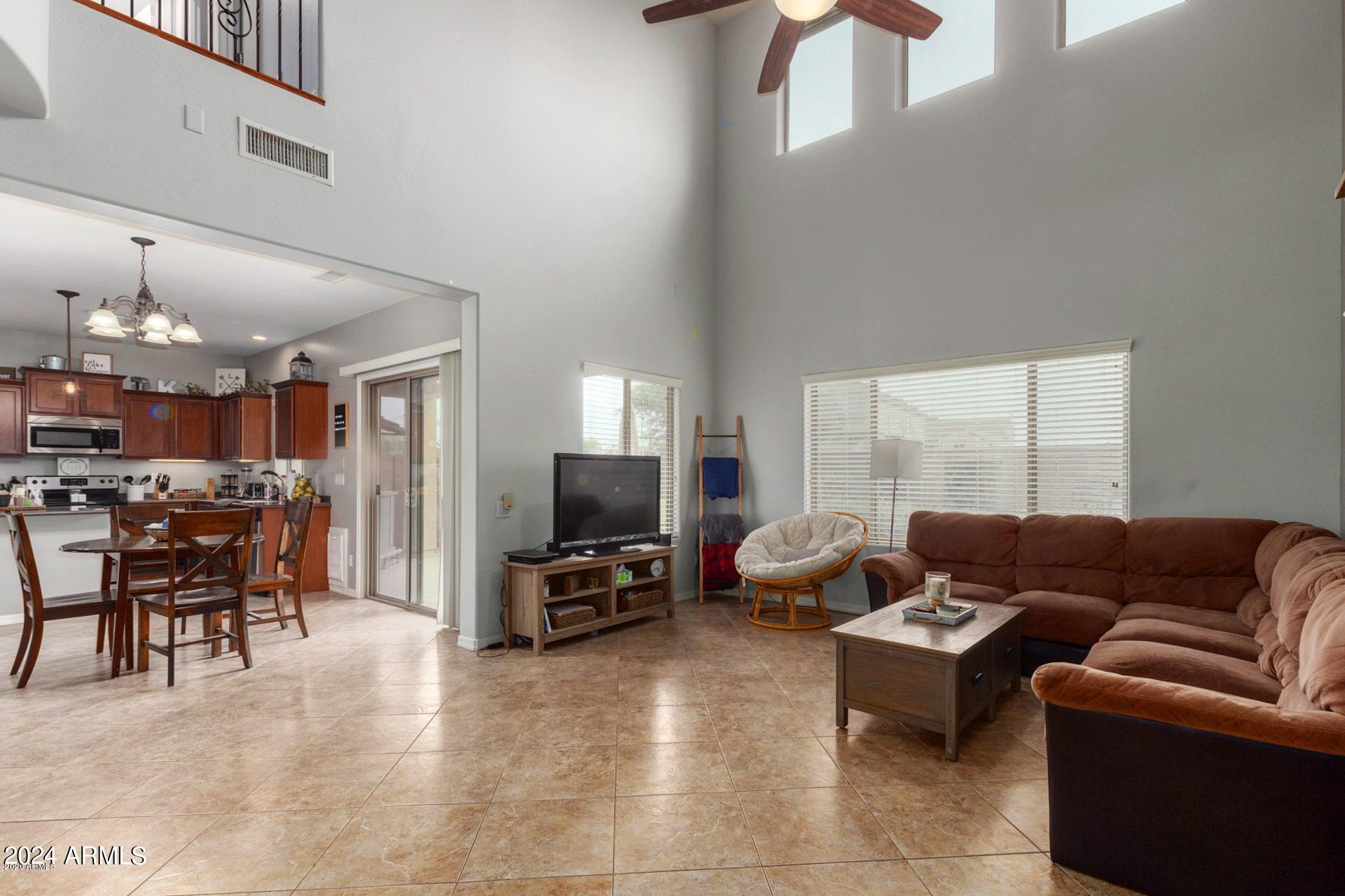 2217 West Kathleen Road Phoenix, AZ 85023 - Photo 4 of 42 a living room with furniture and a flat screen tv