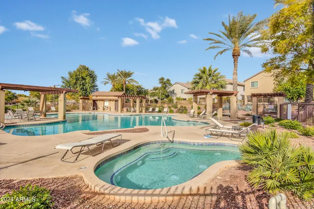 a view of a swimming pool with a patio