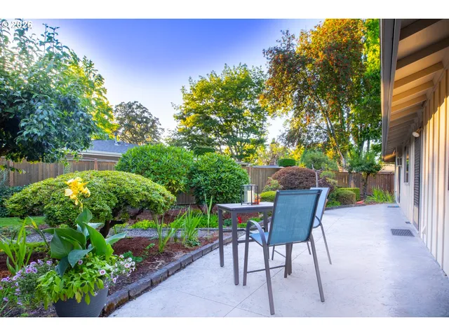 a view of a table and chairs in patio of the house