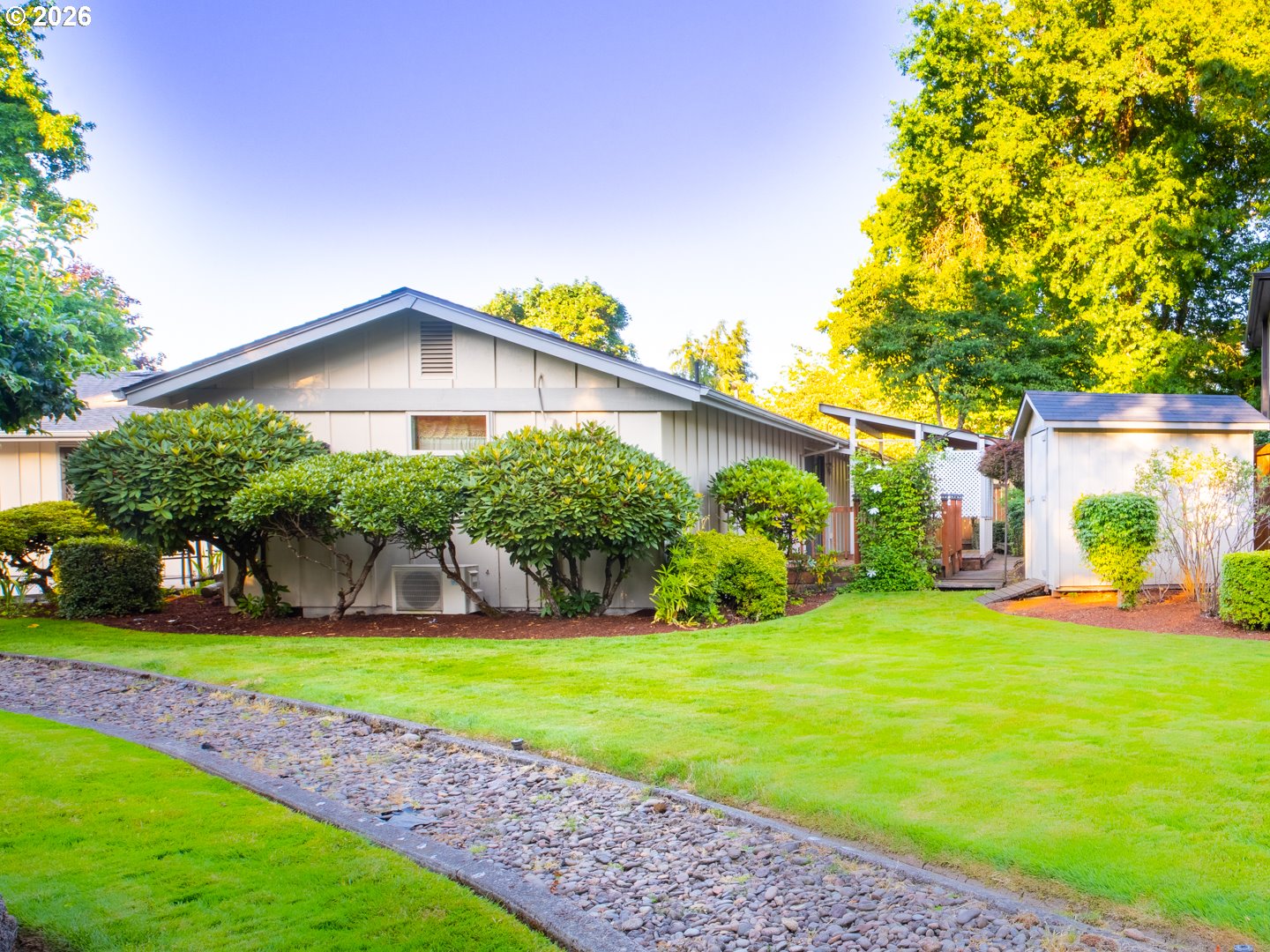 475 Banton Avenue Eugene, OR 97404 - Photo 32 of 34 a view of a house with a yard and plants