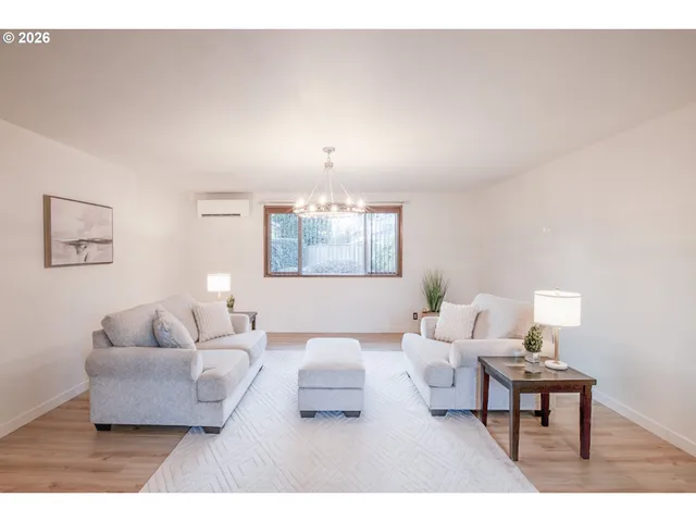 a bedroom with furniture and a lamp