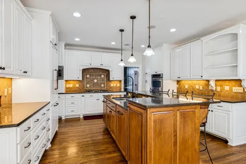 a view of an entryway with wooden floor and stairs