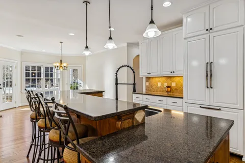 a view of an empty room with a ceiling fan