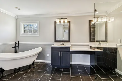 an aerial view of a house with garden space and street view