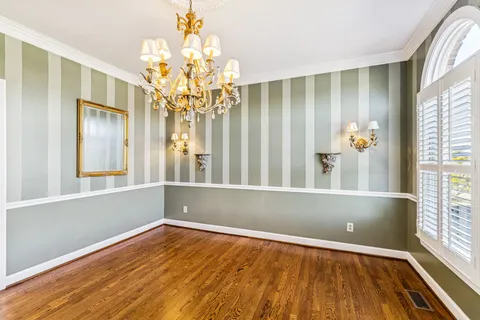 wooden floor in an empty room with a fireplace