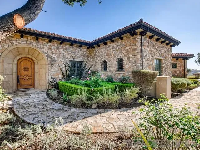 18287 Via Ambiente Rancho Santa Fe, CA 92067 - Photo 1 of 24 a front view of a house with garden