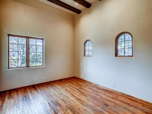 18287 Via Ambiente Rancho Santa Fe, CA 92067 - Photo 20 of 24 an empty room with wooden floor windows and entrance