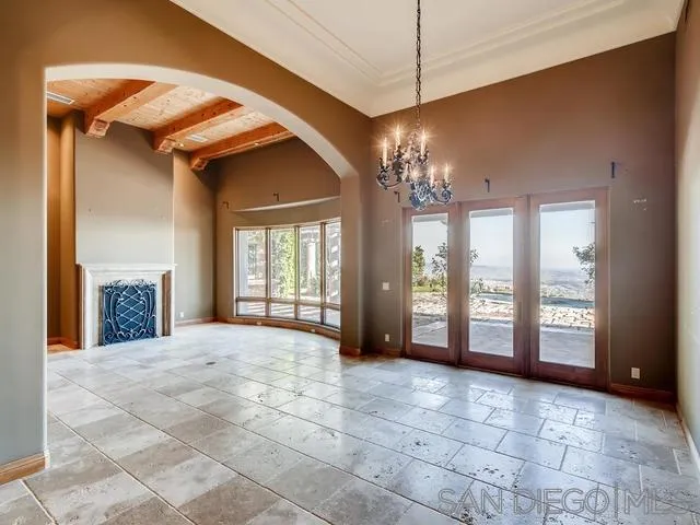 18287 Via Ambiente Rancho Santa Fe, CA 92067 - Photo 8 of 24 a view of a big room with windows and chandelier