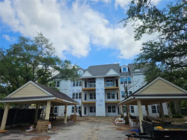a front view of a houses on the roadside