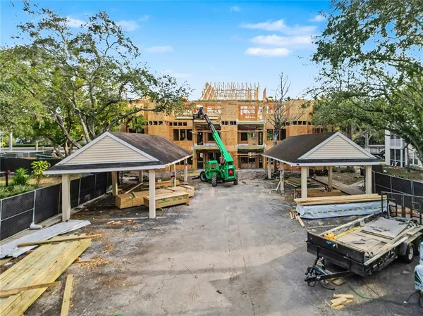 a view of a patio with a table and chairs under an umbrella