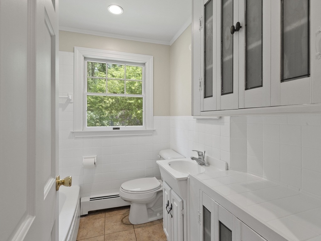 43 Ipswich Road Boxford, MA 01921 - Photo 12 of 25 a bathroom with a sink a toilet and a window