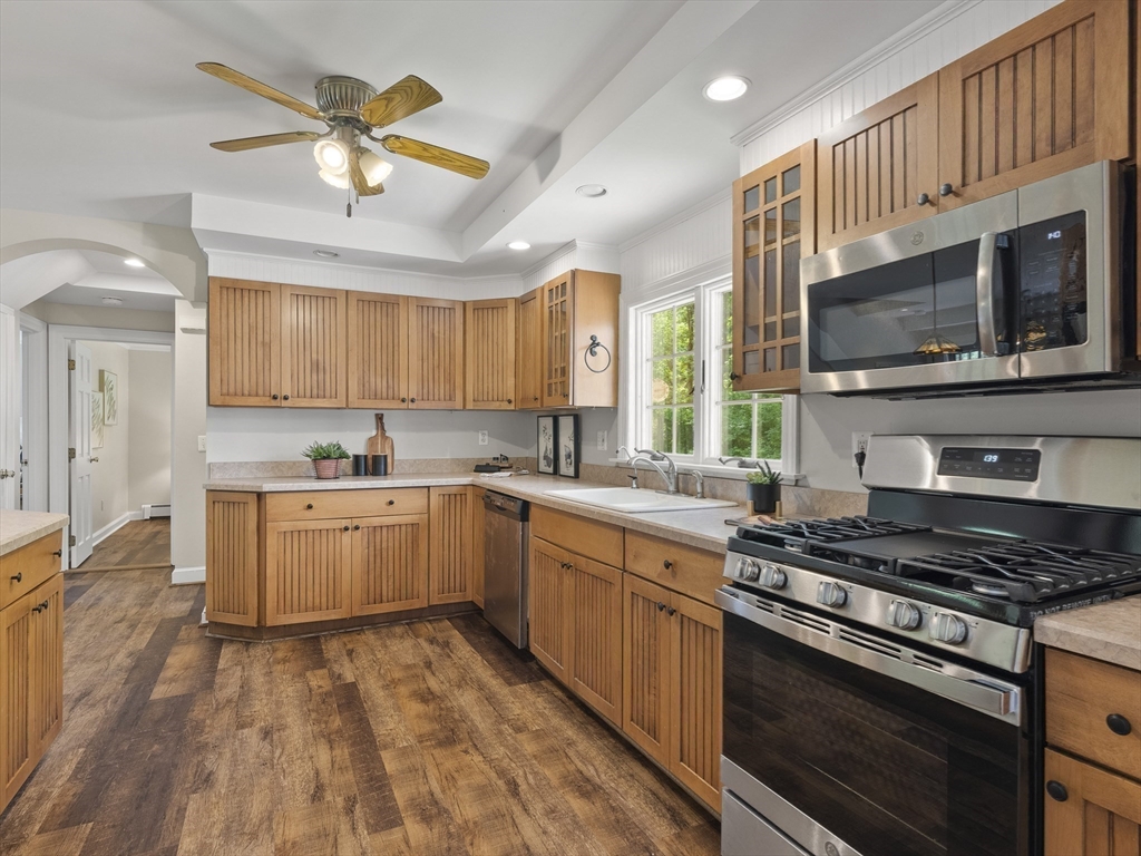 43 Ipswich Road Boxford, MA 01921 - Photo 4 of 25 a kitchen with stainless steel appliances granite countertop a stove and a sink