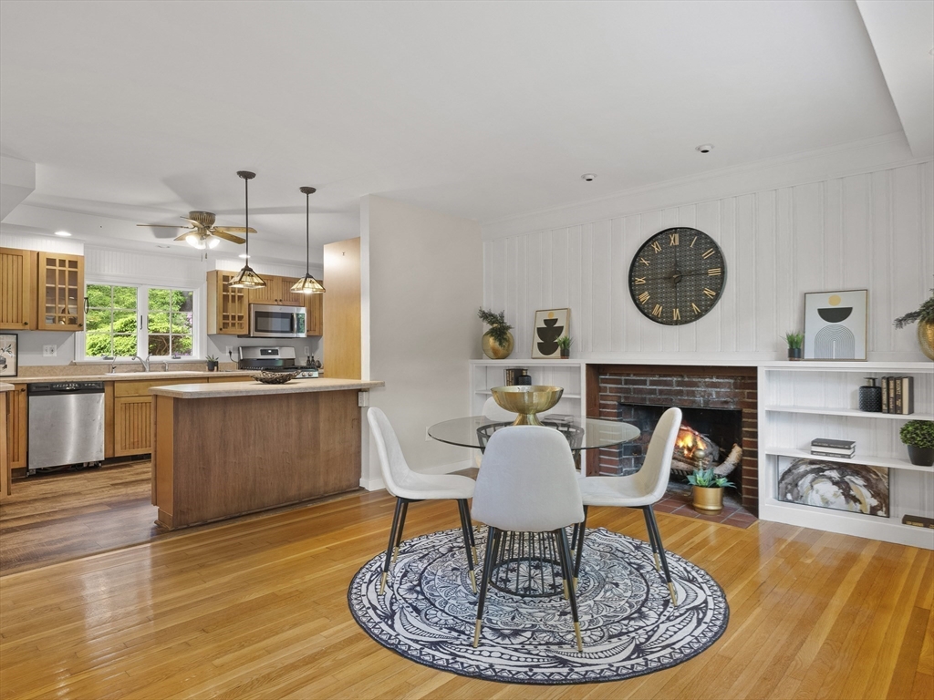 43 Ipswich Road Boxford, MA 01921 - Photo 6 of 25 a living room with furniture a clock and a fireplace