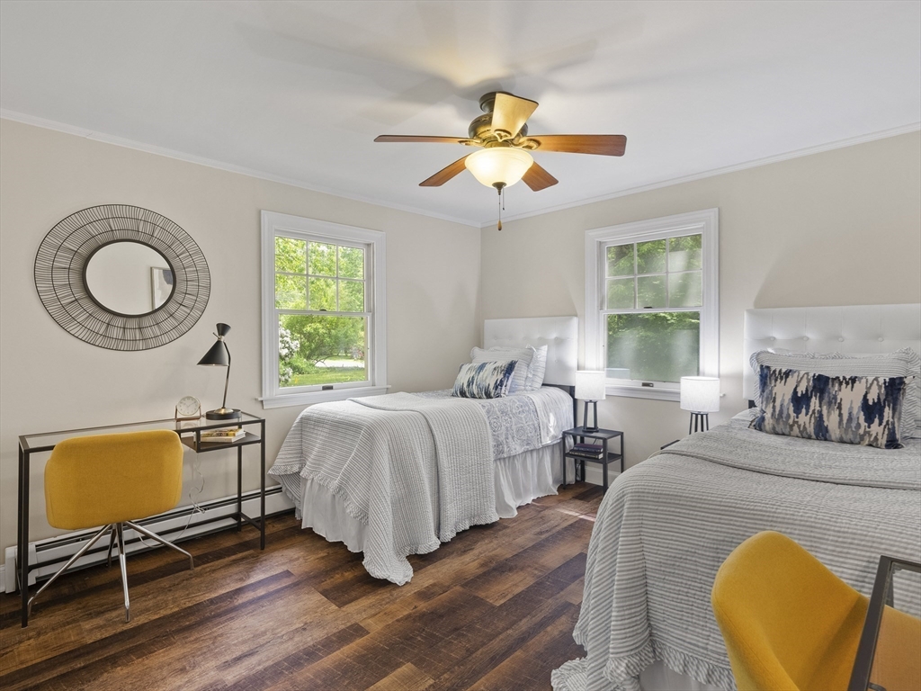 43 Ipswich Road Boxford, MA 01921 - Photo 8 of 25 a bedroom with bed and a chair