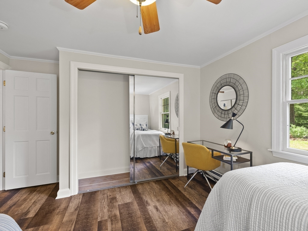 43 Ipswich Road Boxford, MA 01921 - Photo 9 of 25 a view of a bedroom with wooden floor and a window