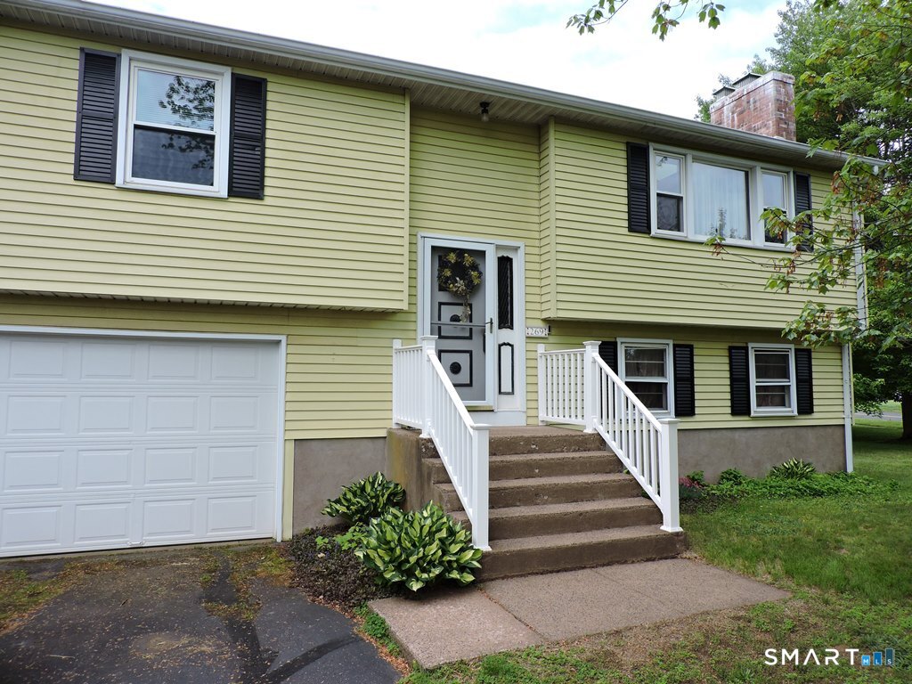 269 Griffin Road South Windsor, CT 06074 - Photo 2 of 36 a front view of a house with a yard