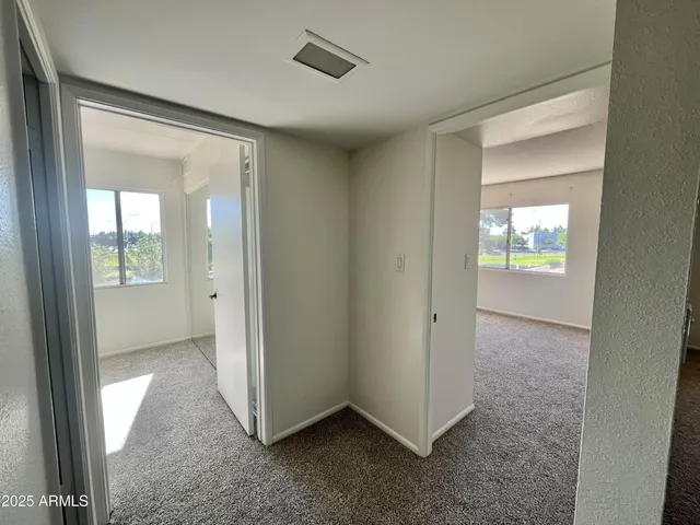 an empty room that has a window in it