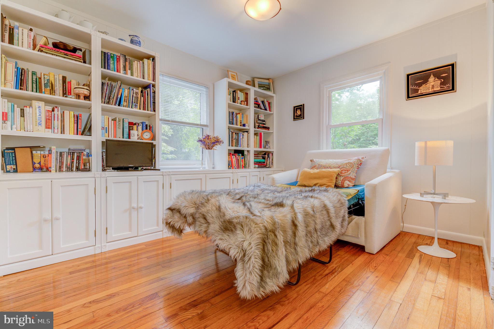 267 Hamilton Avenue Princeton, NJ 08540 - Photo 19 of 39 a bed sitting in a bedroom next to a book shelf