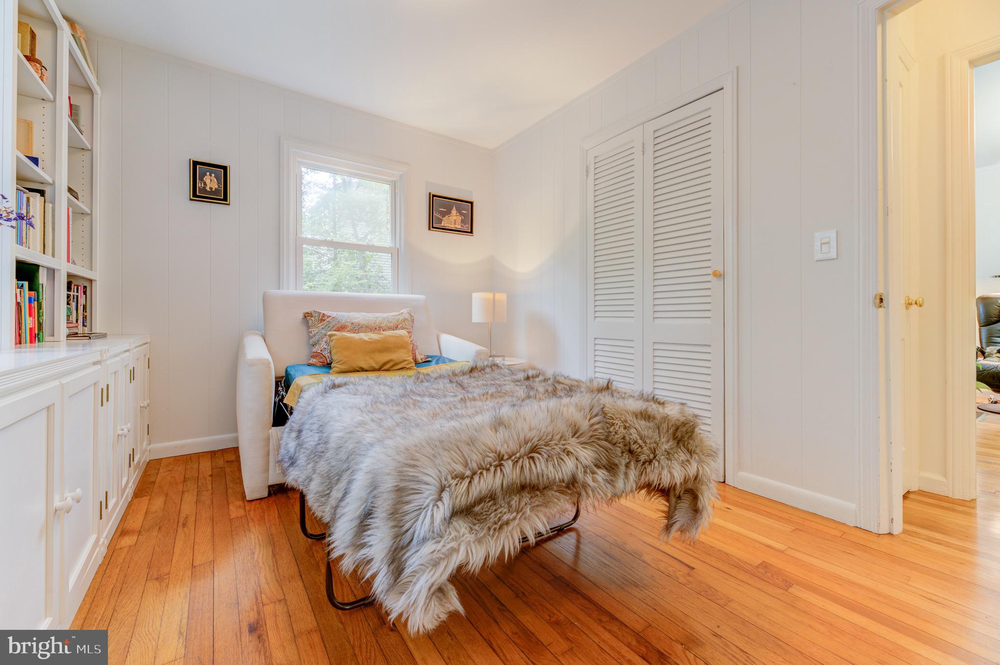 267 Hamilton Avenue Princeton, NJ 08540 - Photo 20 of 39 a bedroom with a bed and wooden floor