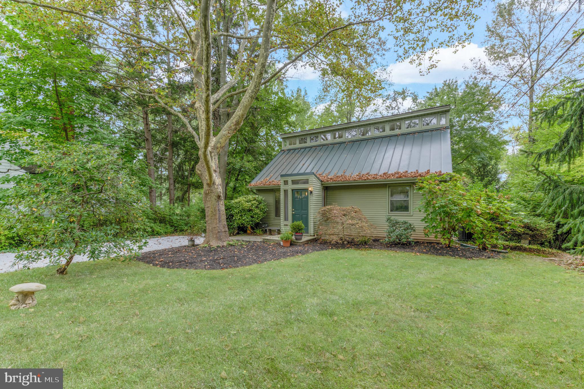267 Hamilton Avenue Princeton, NJ 08540 - Photo 3 of 39 a view of a backyard with table and chairs and a large tree