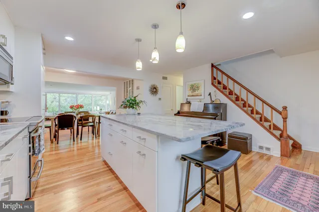 a kitchen with counter top space and a center island