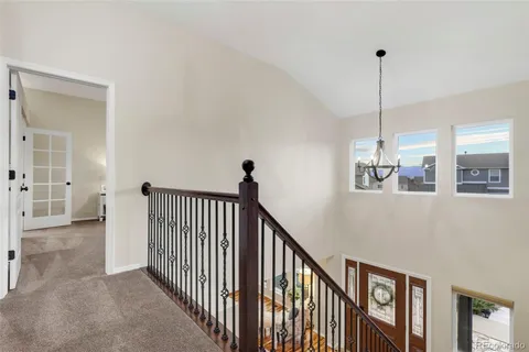 a view of a hallway with windows