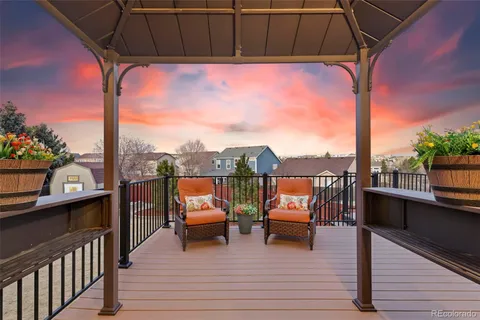 a view of a balcony with chairs