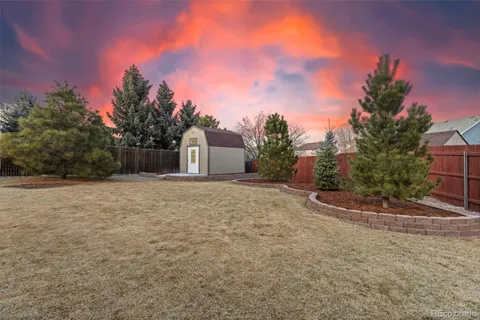 a backyard of a house with lots of green space