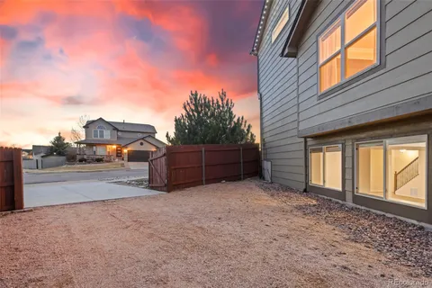 a view of a house with basketball court