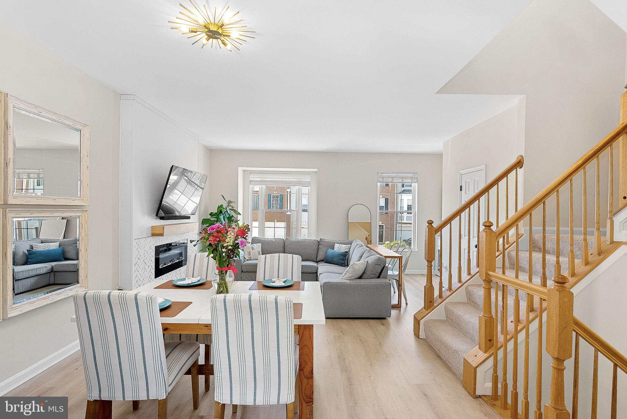 20392 Farmgate Terrace Ashburn, VA 20147 - Photo 13 of 62 a view of a livingroom with furniture wooden floor and windows