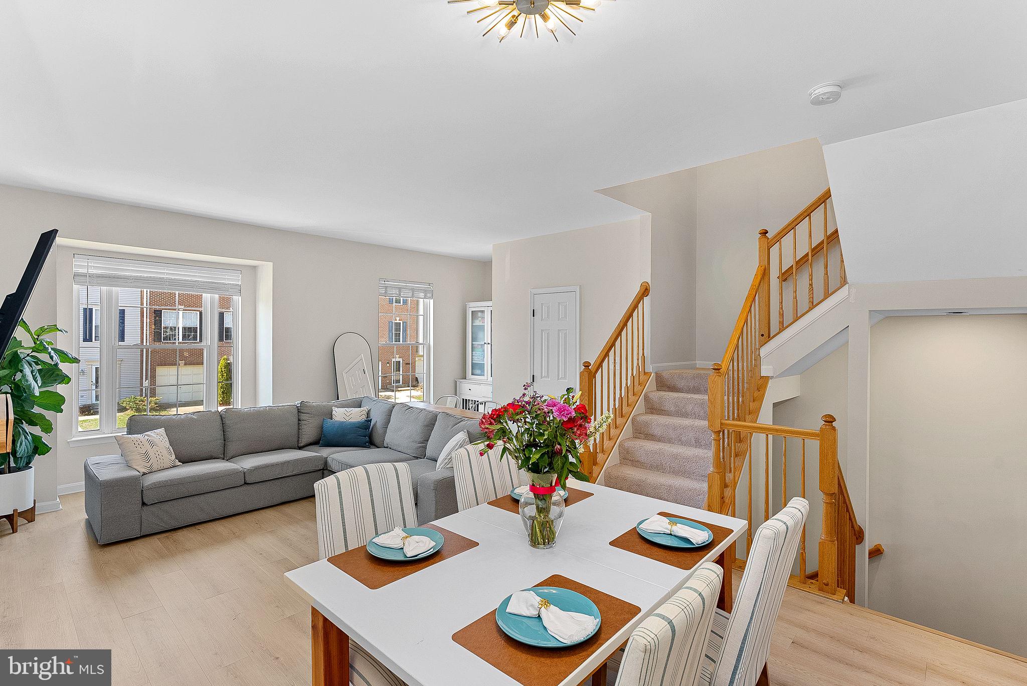 20392 Farmgate Terrace Ashburn, VA 20147 - Photo 17 of 62 a living room with furniture and wooden floor