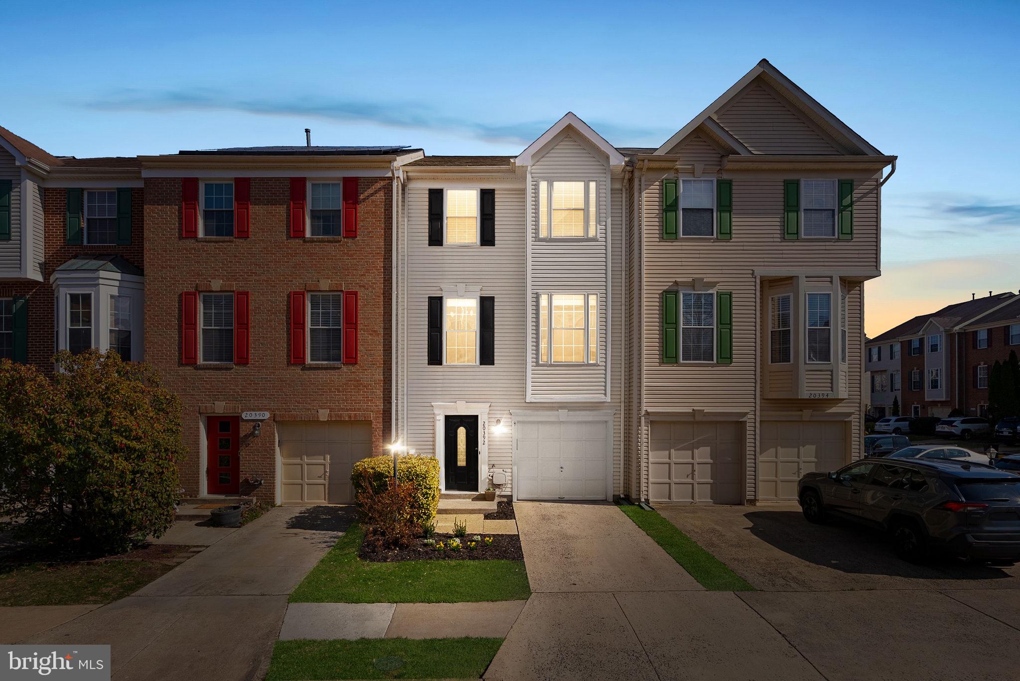 20392 Farmgate Terrace Ashburn, VA 20147 - Photo 2 of 62 a front view of a house with a yard