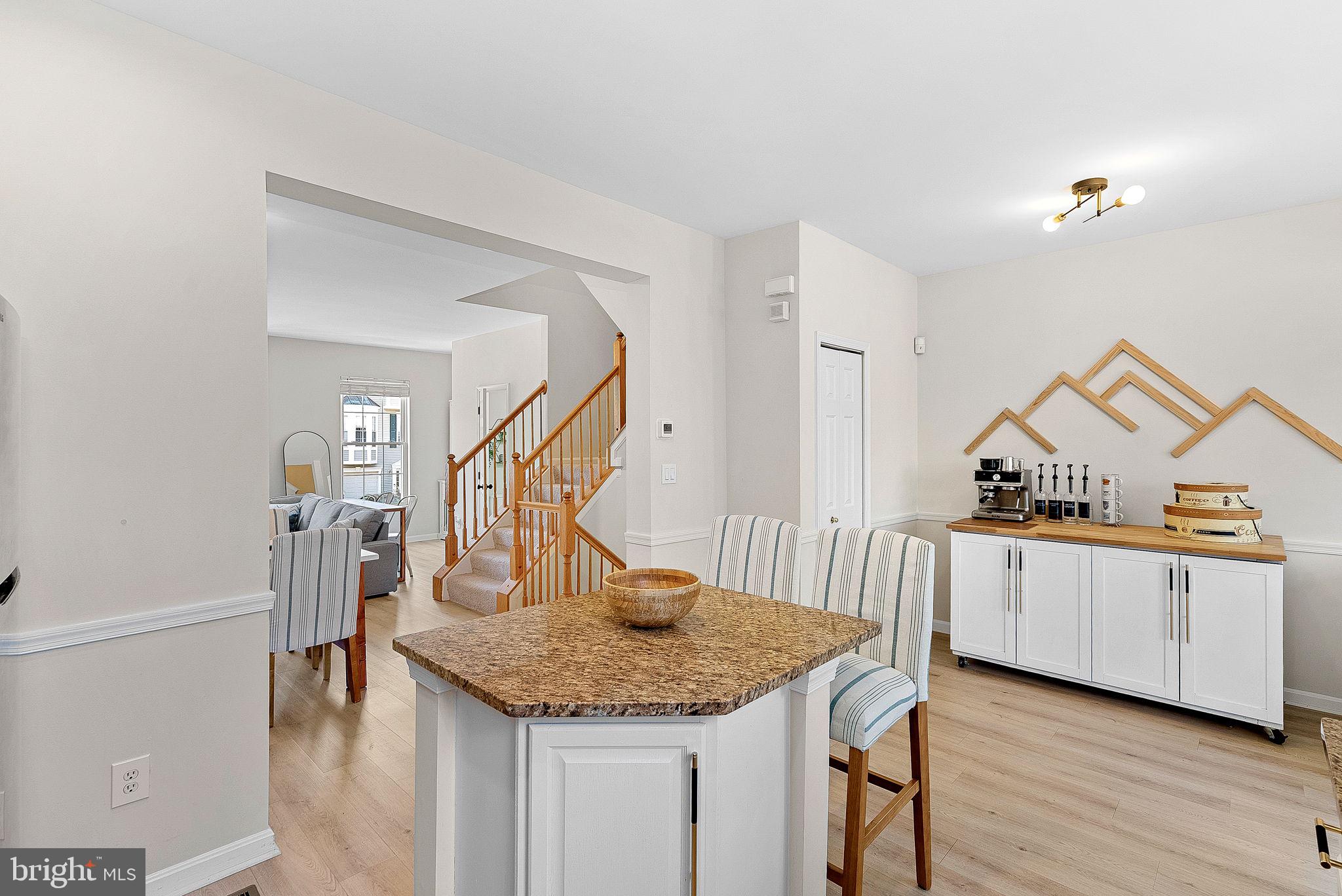 20392 Farmgate Terrace Ashburn, VA 20147 - Photo 22 of 62 a kitchen with stainless steel appliances granite countertop a sink dishwasher a stove and a wooden floor