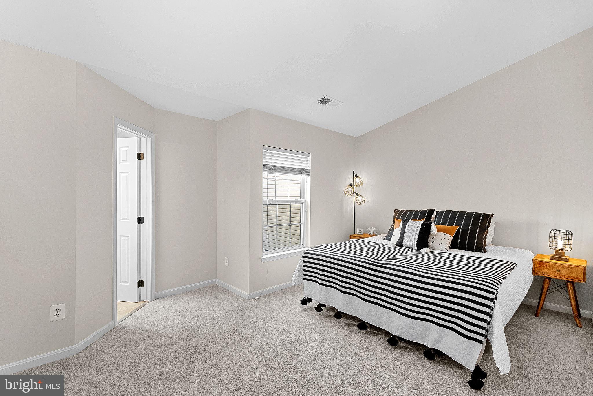 20392 Farmgate Terrace Ashburn, VA 20147 - Photo 29 of 62 a bedroom with a bed and a window