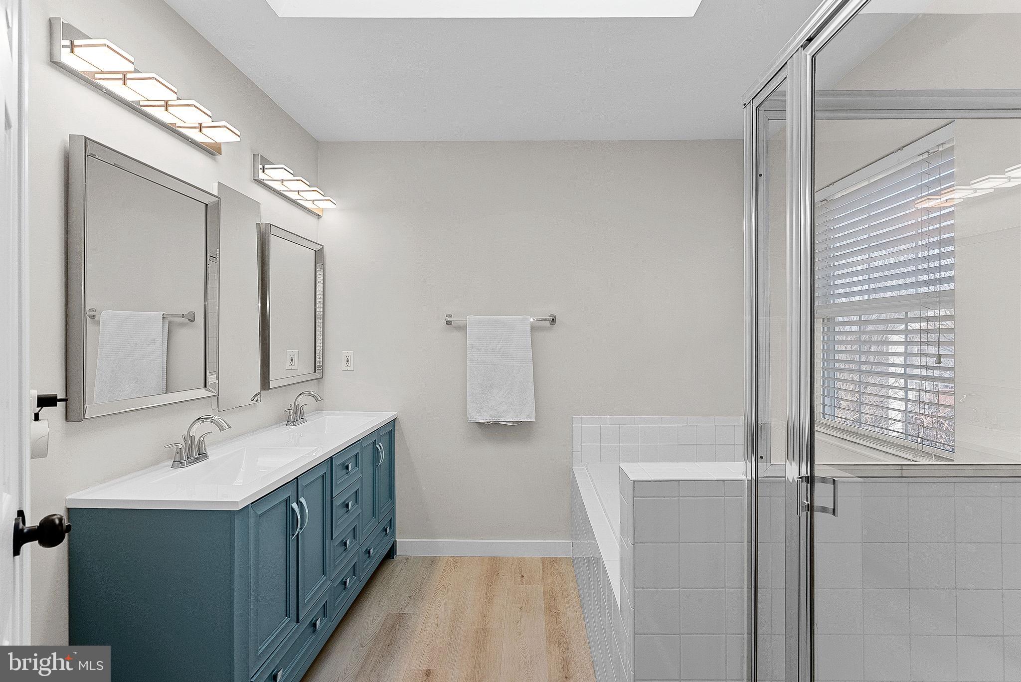 20392 Farmgate Terrace Ashburn, VA 20147 - Photo 36 of 62 a bathroom with a double vanity sink and mirror