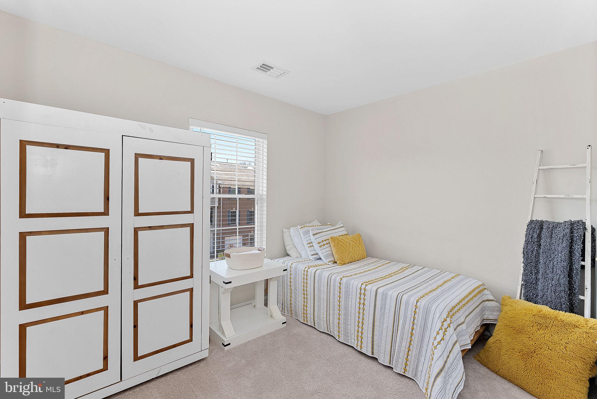 20392 Farmgate Terrace Ashburn, VA 20147 - Photo 38 of 62 a bedroom with a bed and a window
