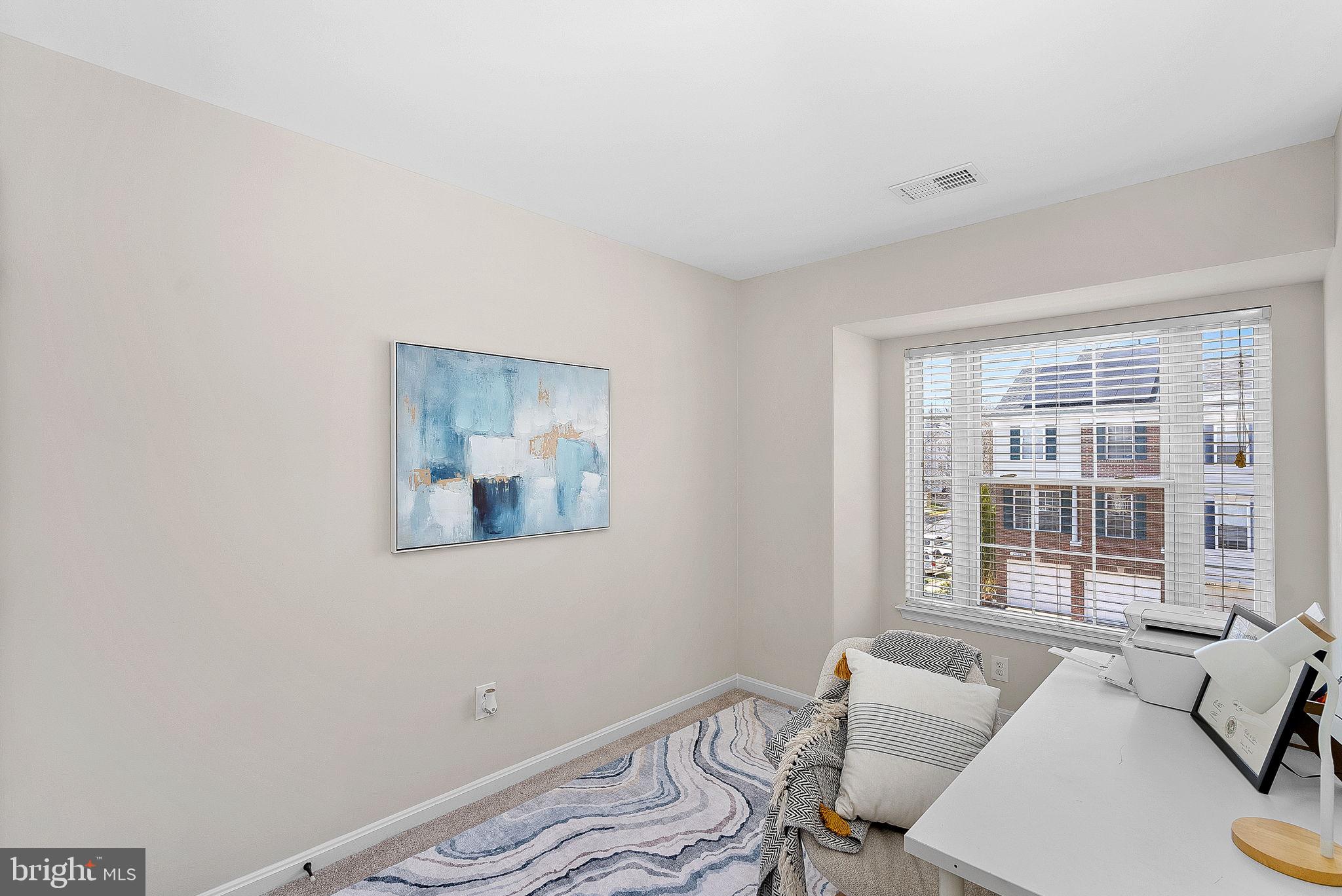 20392 Farmgate Terrace Ashburn, VA 20147 - Photo 39 of 62 a bedroom with a bed and a window