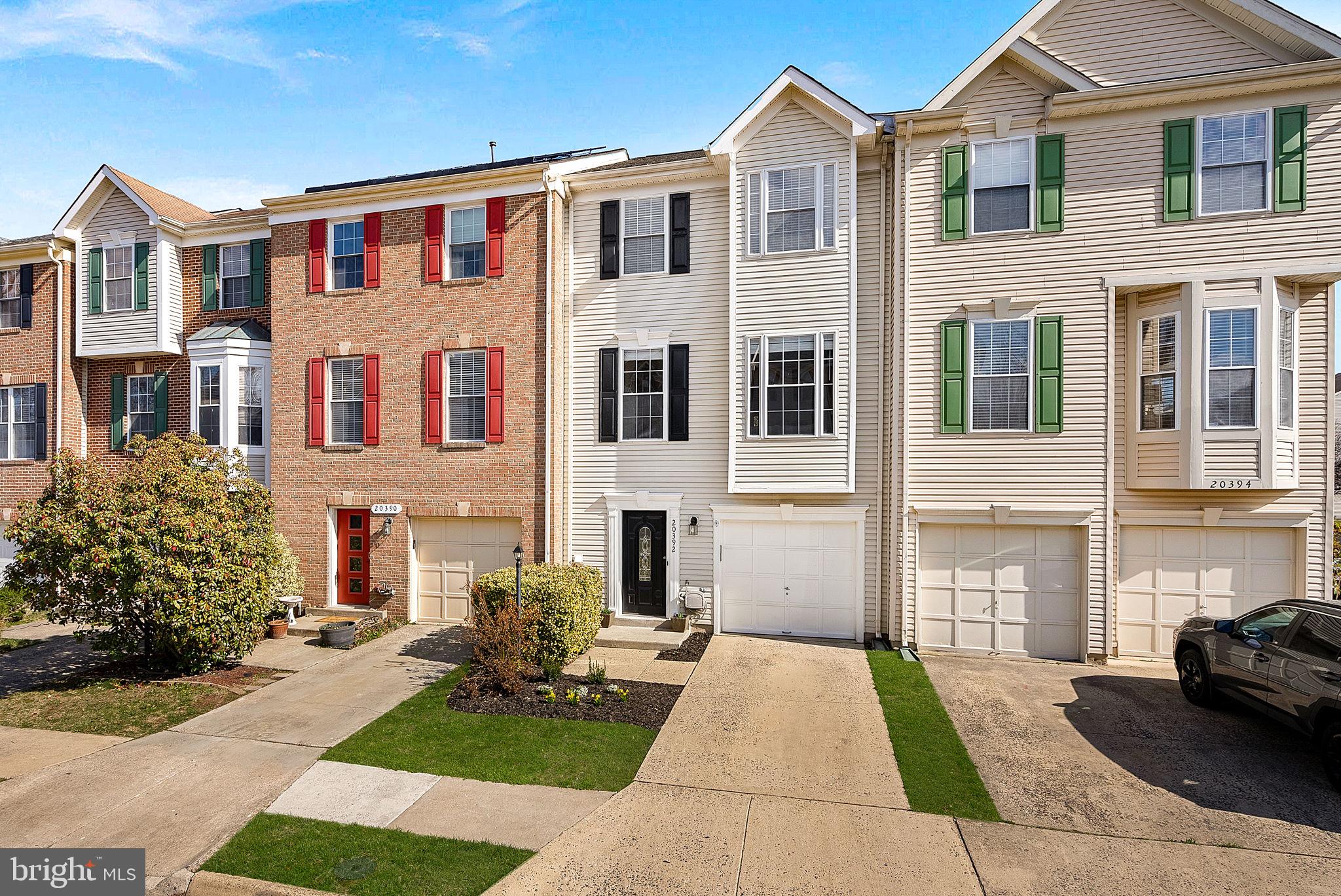 20392 Farmgate Terrace Ashburn, VA 20147 - Photo 4 of 62 a front view of a house with garden