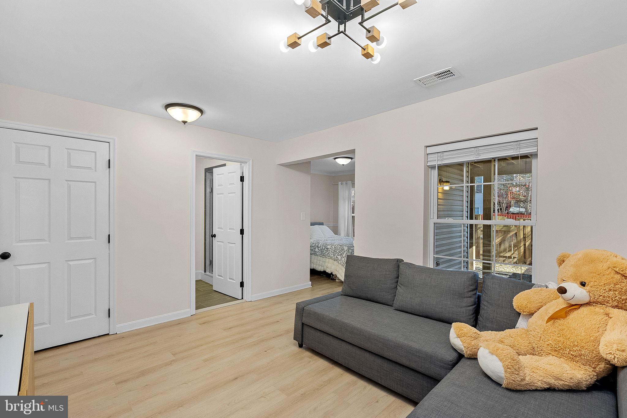 20392 Farmgate Terrace Ashburn, VA 20147 - Photo 42 of 62 a living room with furniture and a large window