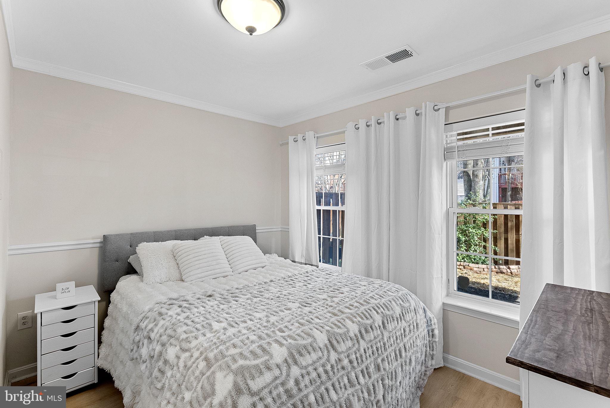20392 Farmgate Terrace Ashburn, VA 20147 - Photo 44 of 62 a bedroom with a large bed and a window