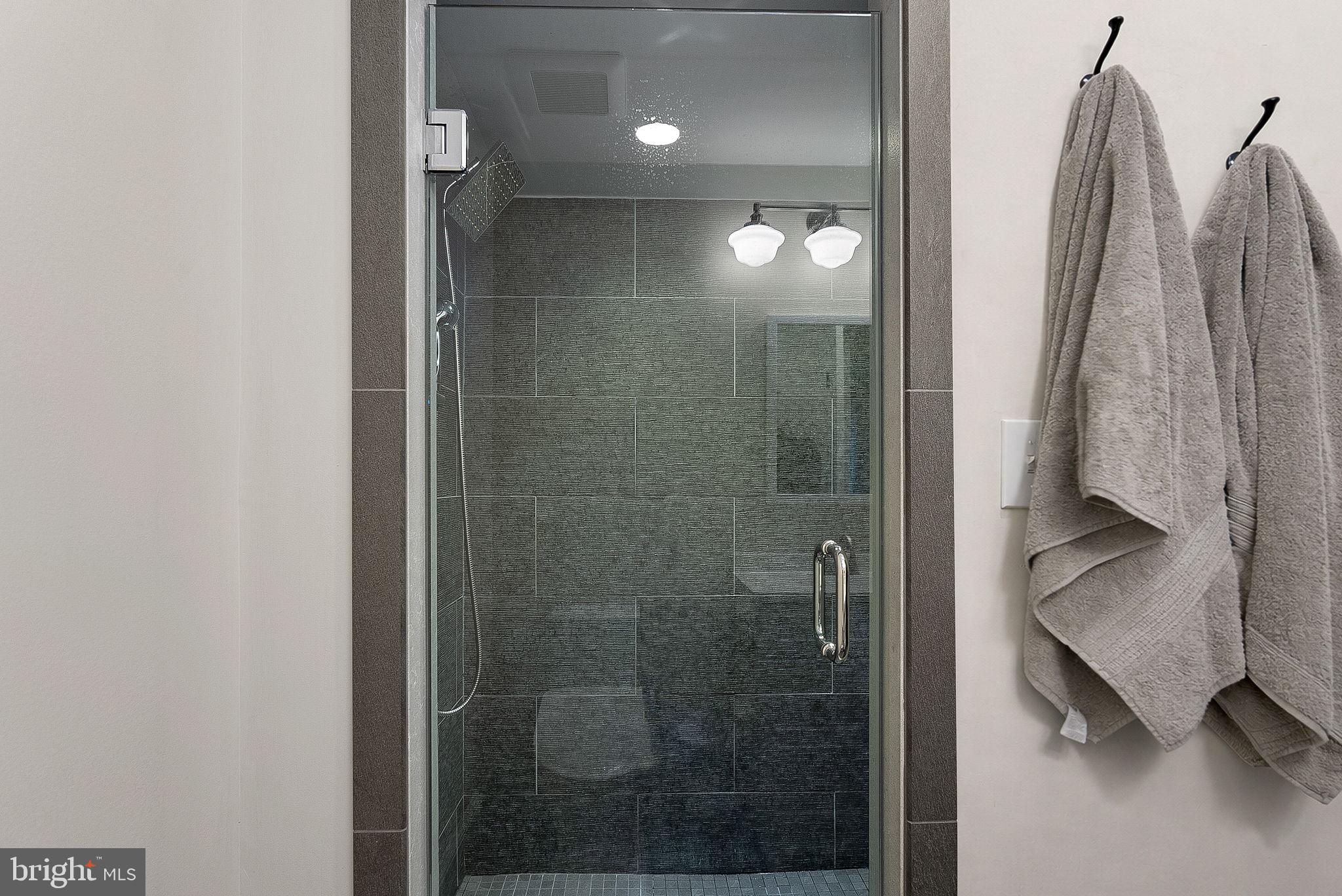 20392 Farmgate Terrace Ashburn, VA 20147 - Photo 46 of 62 a bathroom with a shower
