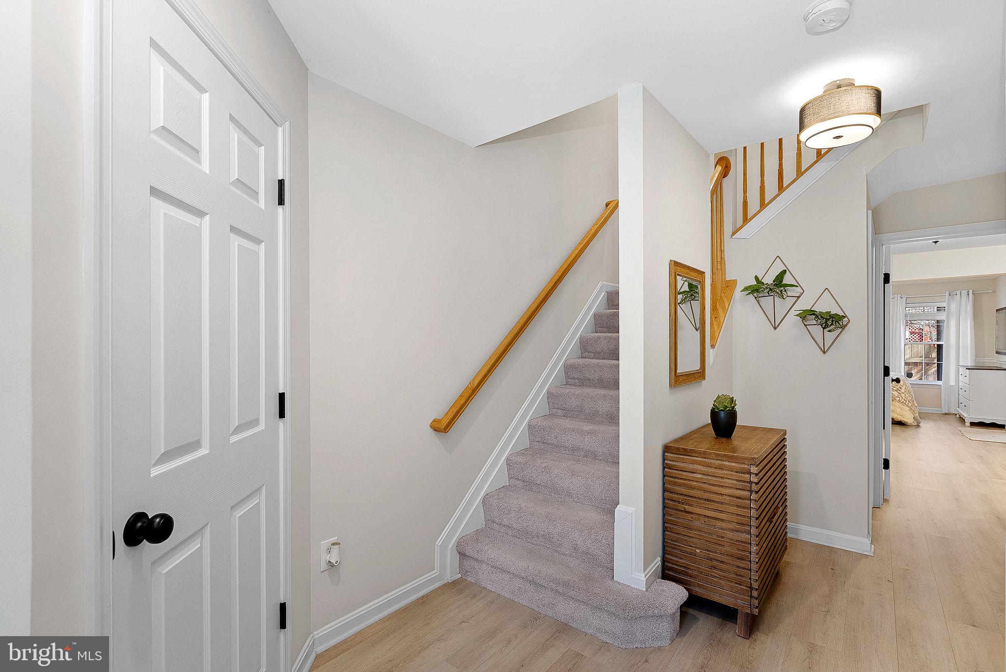 20392 Farmgate Terrace Ashburn, VA 20147 - Photo 5 of 62 a view of entryway with stairs and wooden floor