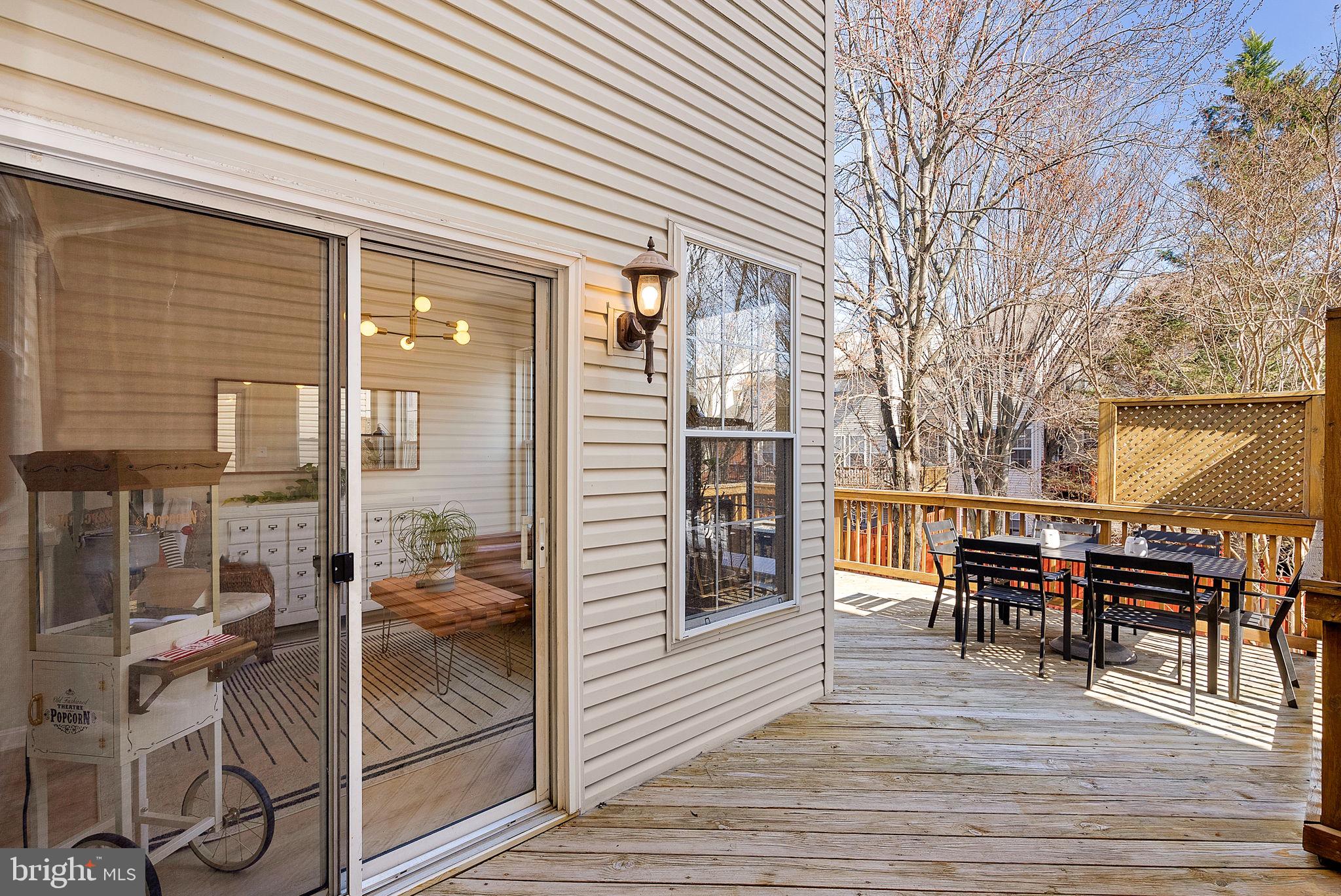 20392 Farmgate Terrace Ashburn, VA 20147 - Photo 51 of 62 a view of a dinning table and chairs in the patio