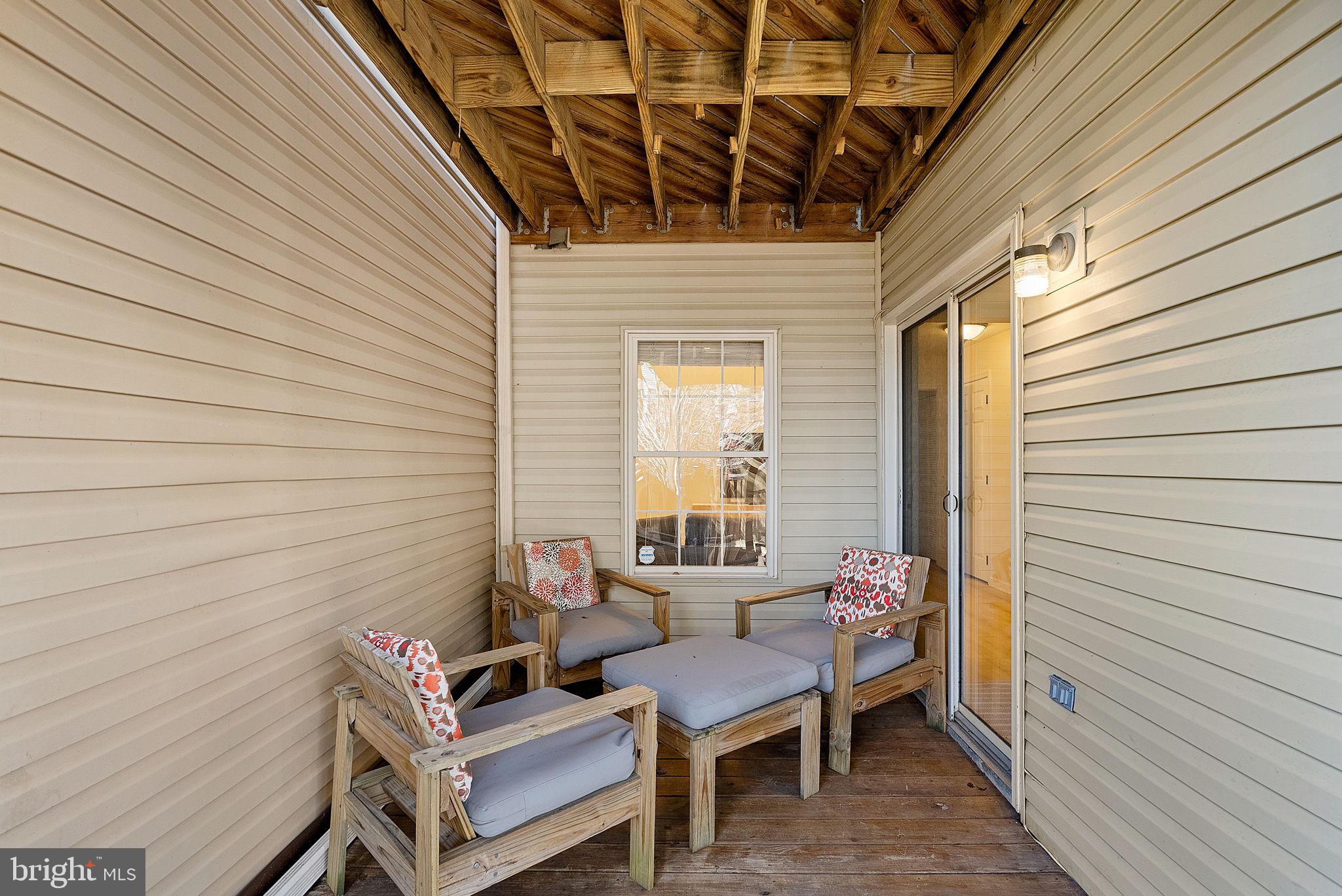 20392 Farmgate Terrace Ashburn, VA 20147 - Photo 54 of 62 a view of a patio with chairs and a table