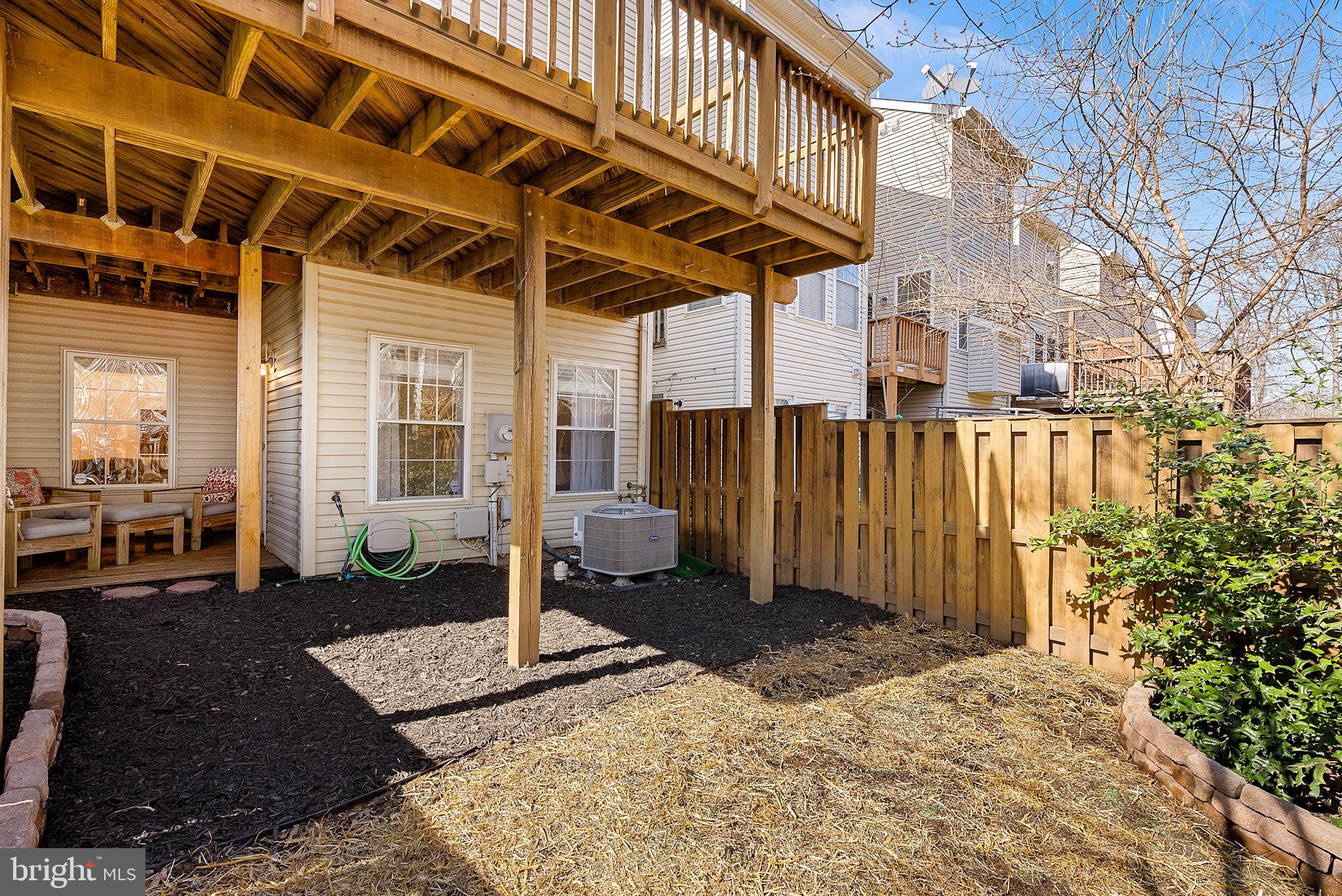 20392 Farmgate Terrace Ashburn, VA 20147 - Photo 55 of 62 a view of a backyard with a patio