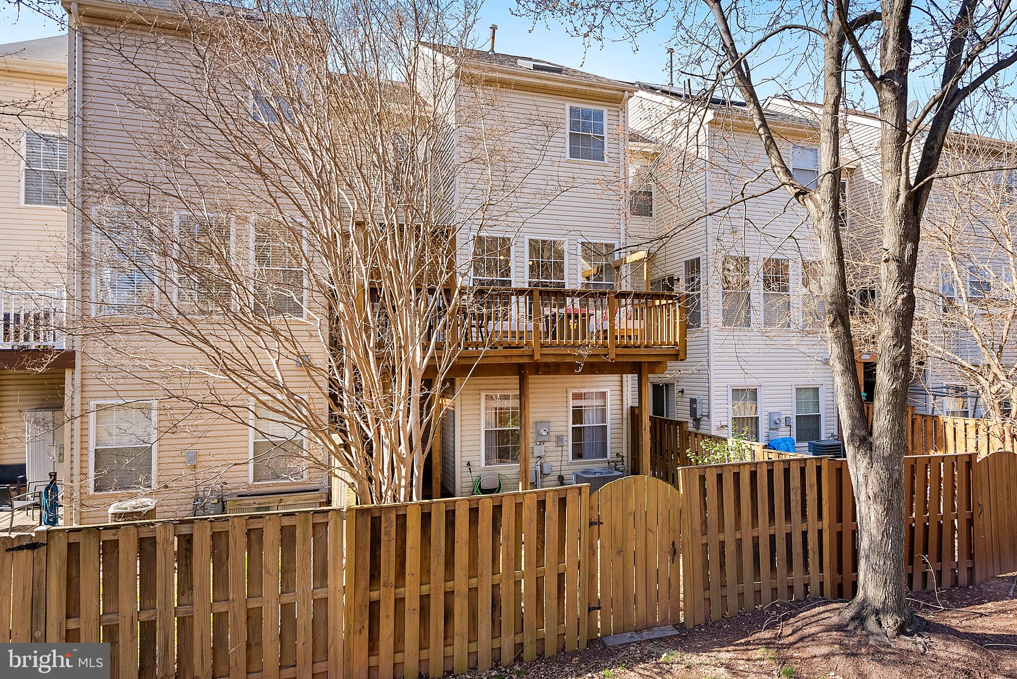 20392 Farmgate Terrace Ashburn, VA 20147 - Photo 58 of 62 front view of a house with a small yard