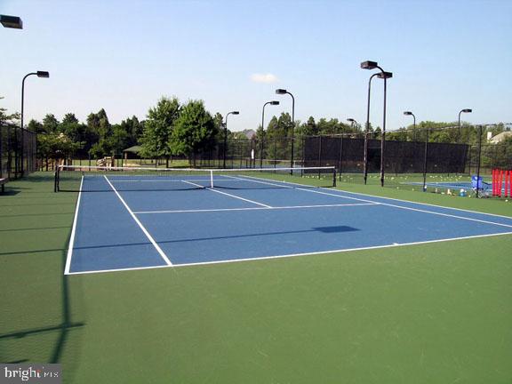 20392 Farmgate Terrace Ashburn, VA 20147 - Photo 61 of 62 a tennis court that has tennis net