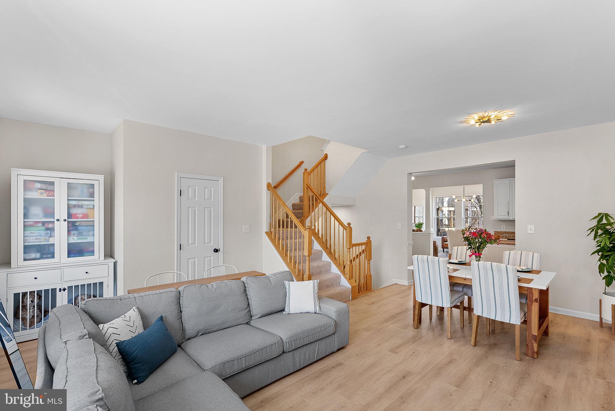 20392 Farmgate Terrace Ashburn, VA 20147 - Photo 10 of 62 a living room with furniture and a wooden floor