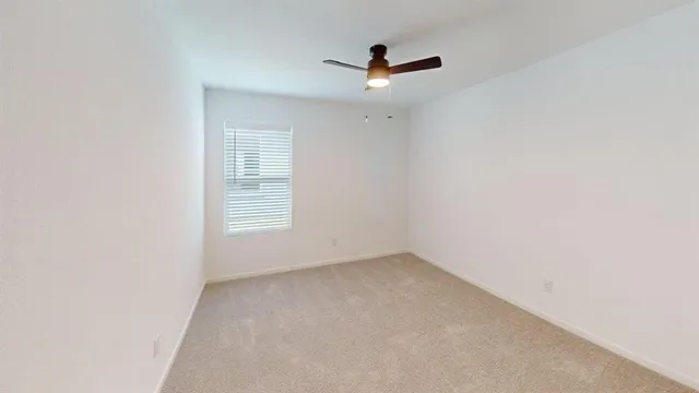 a view of a big room with windows